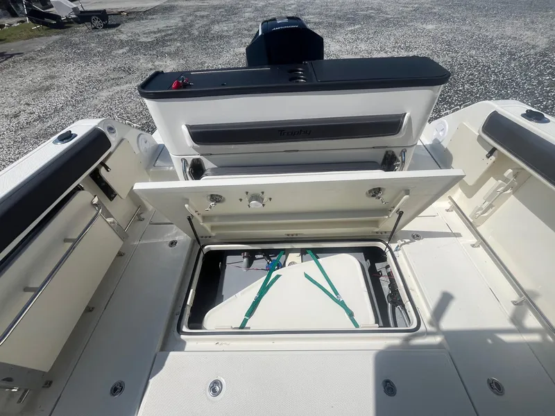 Slide: The Image of 2025 Bayliner Trophy T25 Pilothouse boat with open storage compartment. - 31