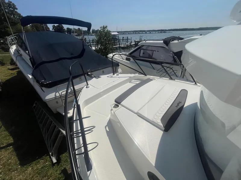 Slide: The Image of 2025 Bayliner Trophy T25 Pilothouse boat docked by the water. - 37
