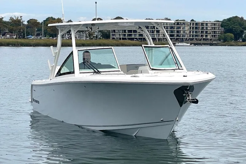 Slide: The Image of 2025 Sailfish 276 DC boat on calm water with modern design. - 6