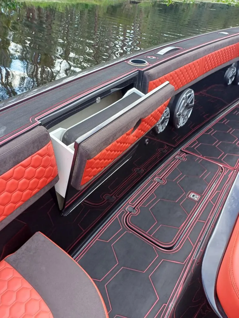 Slide: The Image of 2022 Midnight Express 43' Solstice boat interior with red hexagonal upholstery and sleek design. - 15