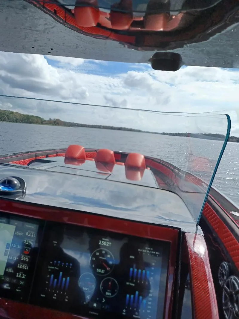Slide: The Image of 2022 Midnight Express 43' Solstice boat dashboard view on open water. - 24