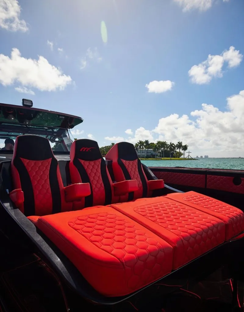 Slide: The Image of Luxury seating on 2022 Midnight Express 43' Solstice boat, with ocean view and blue sky. - 27