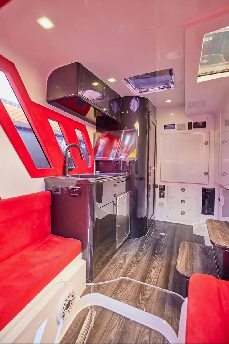Slide: The Image of Luxurious interior of 2022 Midnight Express 43' Solstice with modern design and vibrant red accents. - 28