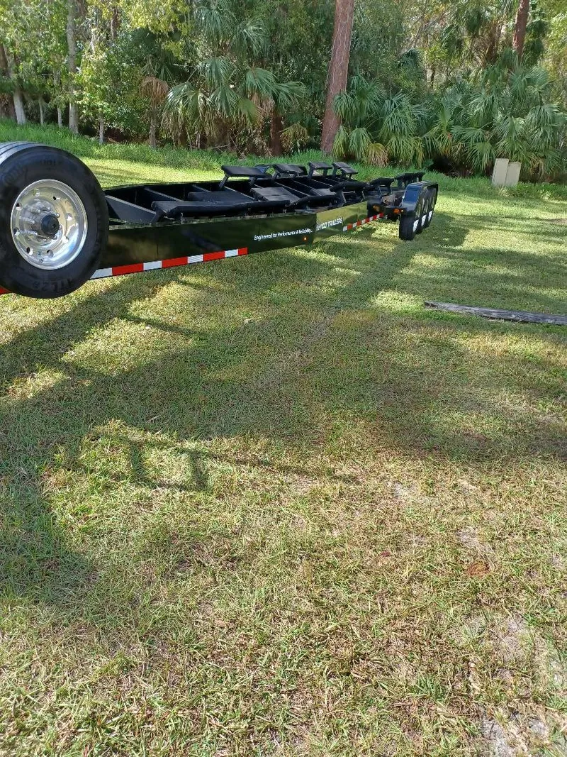 Slide: The Image of 2022 Midnight Express 43' Solstice trailer on grass, surrounded by trees. - 35