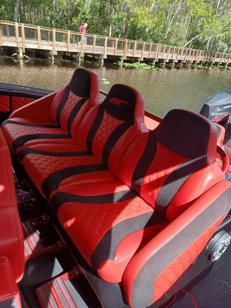 Slide: The Image of Luxurious red and black seating on 2022 Midnight Express 43' Solstice boat. - 8