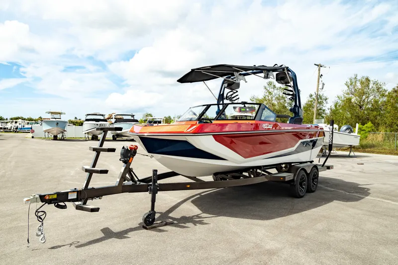 Slide: The Image of 2025 Nautique Super Air Nautique GS20 boat on trailer, parked outdoors. - 10