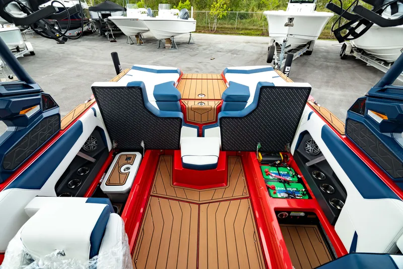 Slide: The Image of 2025 Nautique Super Air Nautique GS20 interior with seating and storage compartments. - 19