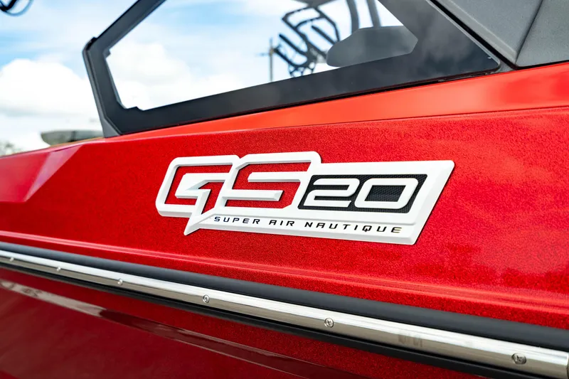 Slide: The Image of 2025 Nautique Super Air Nautique GS20 logo on red boat exterior. - 2
