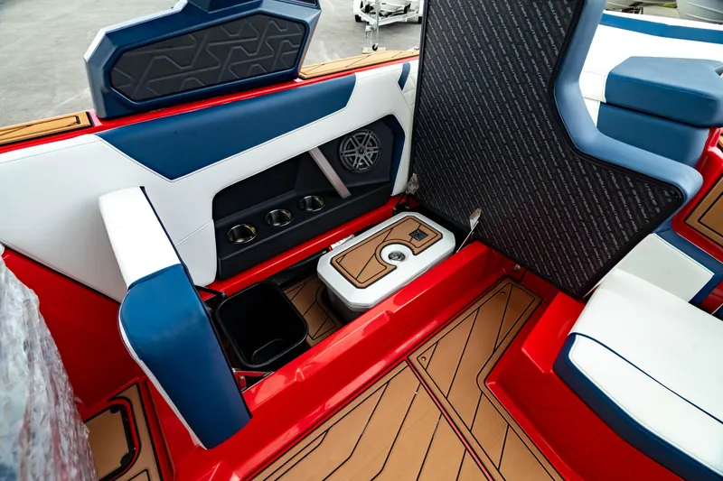 Slide: The Image of Interior of 2025 Nautique Super Air Nautique GS20 boat with red, blue, and white seating. - 20