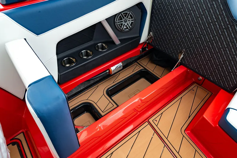 Slide: The Image of 2025 Nautique Super Air Nautique GS20 interior with cup holders and speaker. - 21