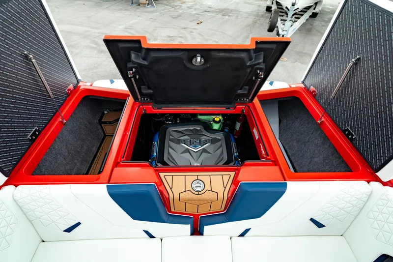 Slide: The Image of 2025 Nautique Super Air Nautique GS20 engine compartment with open hatches and seating. - 26