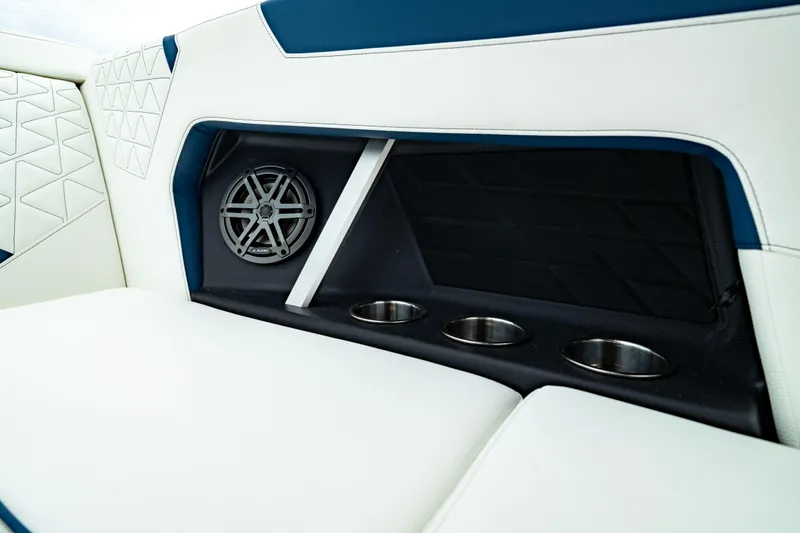 Slide: The Image of 2025 Nautique Super Air Nautique GS20 interior with speaker and cup holders. - 30