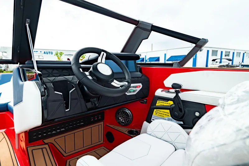 Slide: The Image of Interior of 2025 Nautique Super Air Nautique GS20 boat, featuring modern steering and controls. - 31