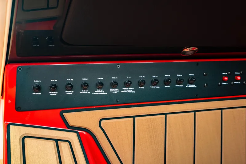 Slide: The Image of Control panel of 2025 Nautique Super Air Nautique GS20 boat, featuring various switches. - 36