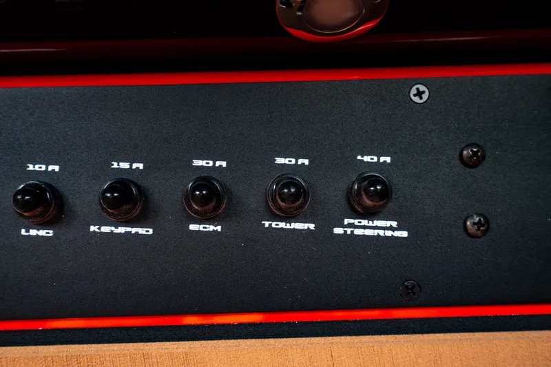 Slide: The Image of Control panel of 2025 Nautique Super Air Nautique GS20 boat with labeled switches. - 40