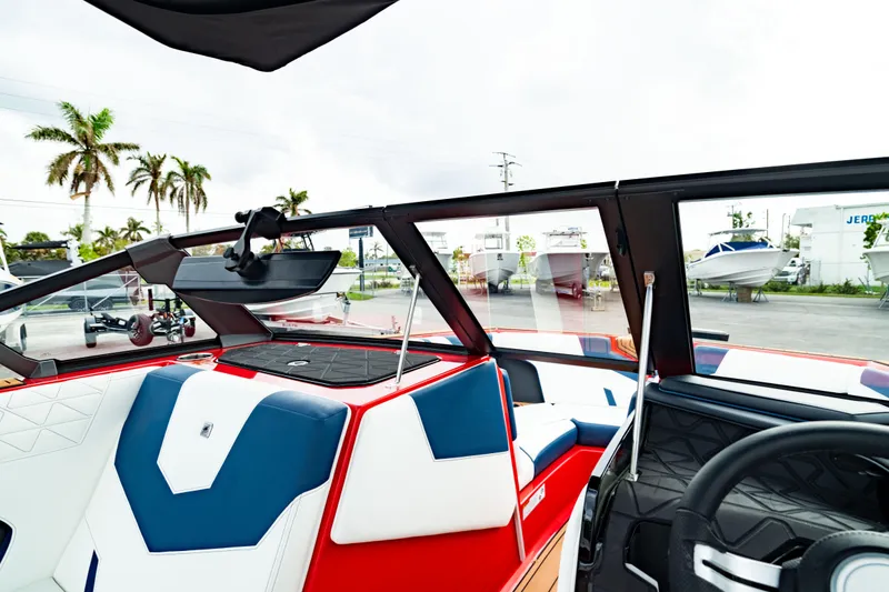 Slide: The Image of 2025 Nautique Super Air Nautique GS20 interior with red, white, and blue seating. - 41
