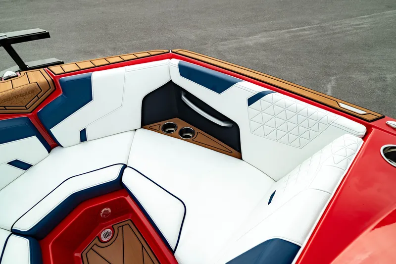 Slide: The Image of 2025 Nautique Super Air Nautique GS20 interior with red, white, and blue seating. - 44