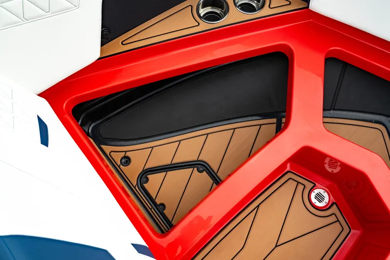 Slide: The Image of 2025 Nautique Super Air Nautique GS20 interior detail with red and tan accents. - 48