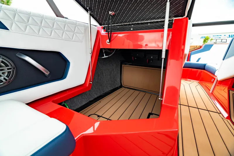 Slide: The Image of 2025 Nautique Super Air Nautique GS20 interior with red accents and modern design. - 6