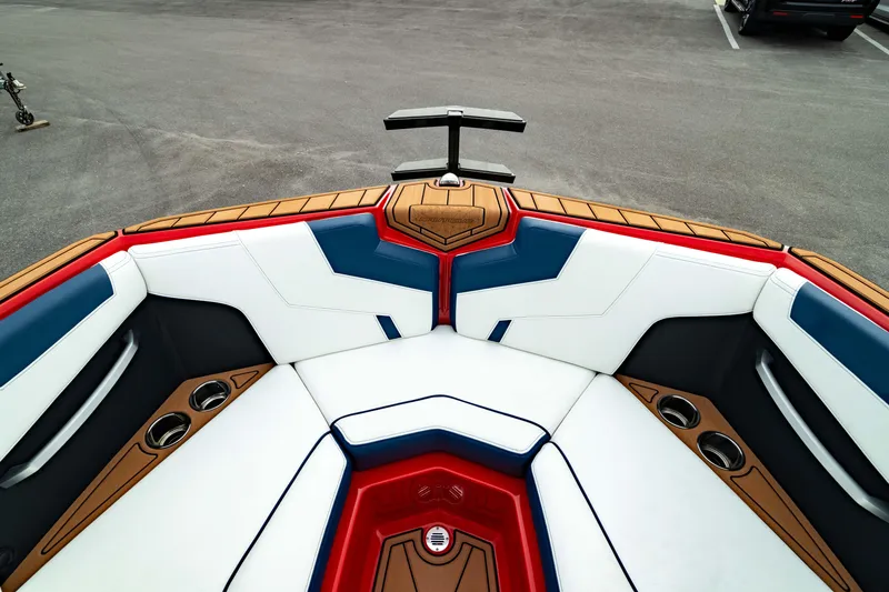 Slide: The Image of 2025 Nautique Super Air Nautique GS20 boat interior with stylish seating and cup holders. - 7