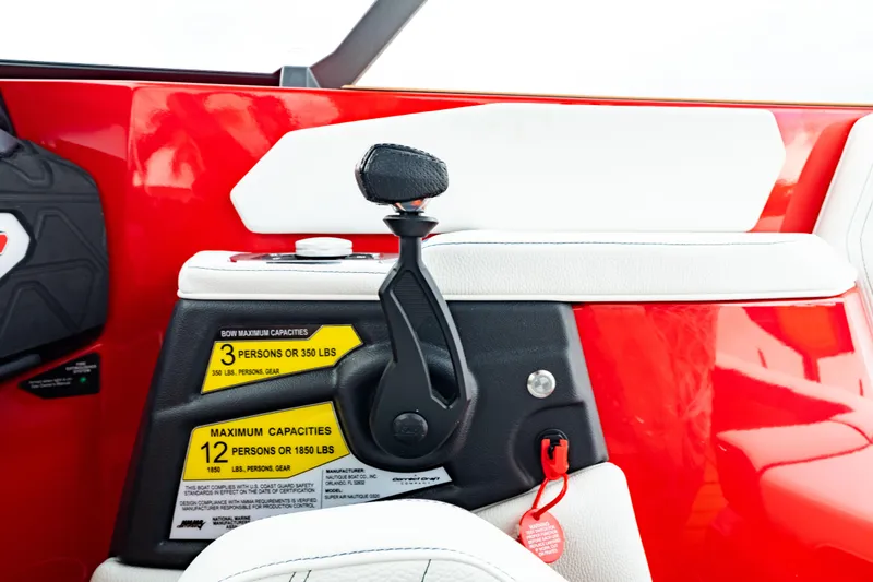 Slide: The Image of 2025 Nautique Super Air Nautique GS20 interior, red and white design, capacity labels visible. - 8