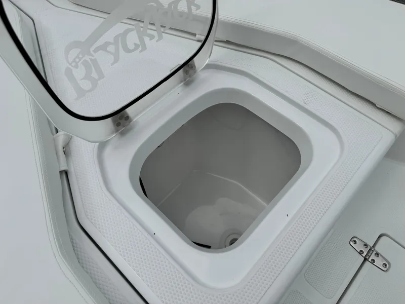Slide: The Image of Open storage compartment on 2025 BlackJack 256 Coastal boat. - 13