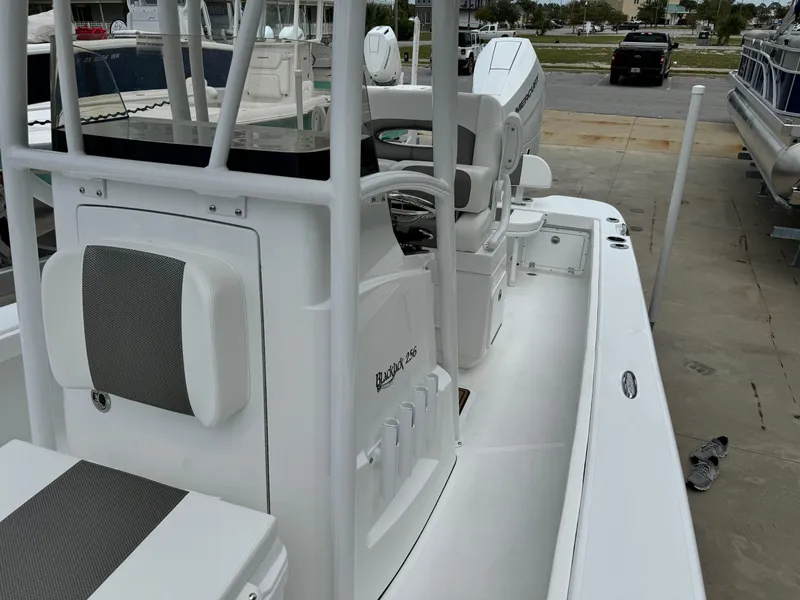 Slide: The Image of 2025 BlackJack 256 Coastal boat, white interior, docked at marina. - 18