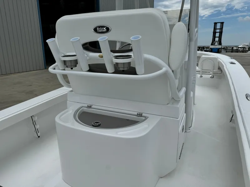 Slide: The Image of 2025 BlackJack 256 Coastal boat interior with rod holders and storage compartment. - 24