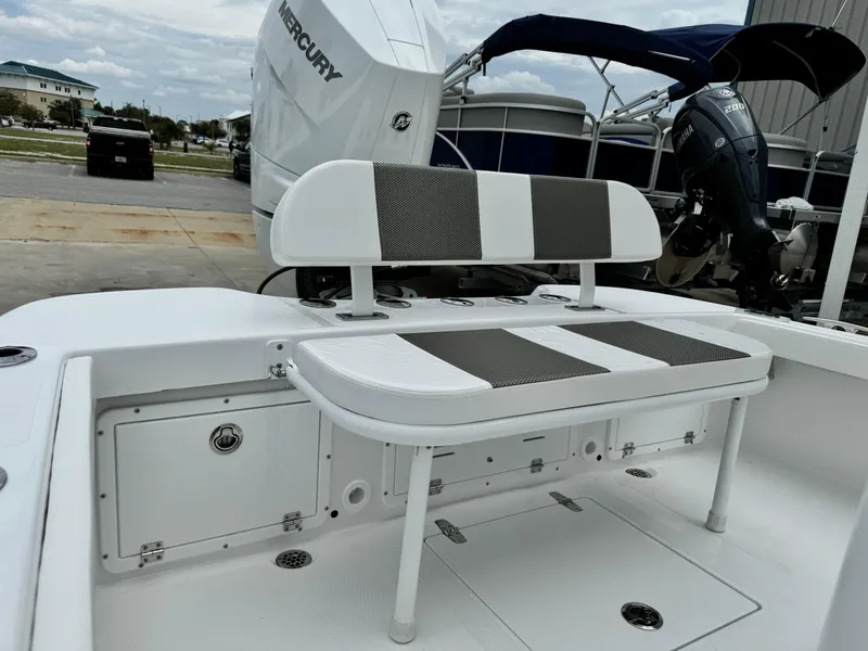 Slide: The Image of 2025 BlackJack 256 Coastal boat with seating and Mercury outboard engine. - 25