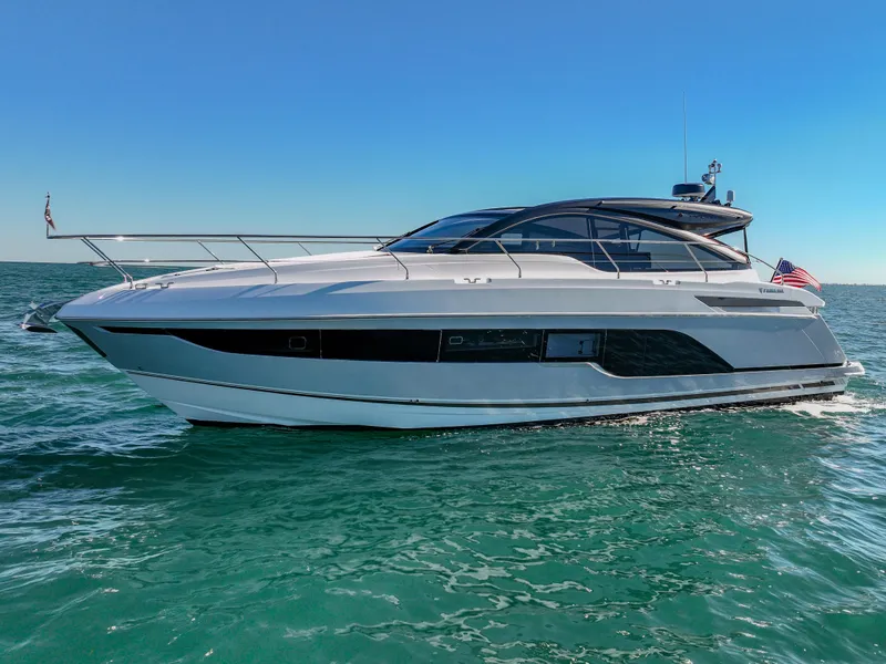 Slide: The Image of 2025 Fairline Targa 45 Open yacht cruising on clear blue waters. - 0