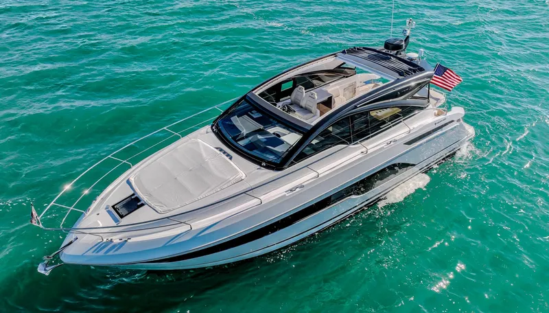 Slide: The Image of 2025 Fairline Targa 45 Open yacht cruising on clear blue water. - 1