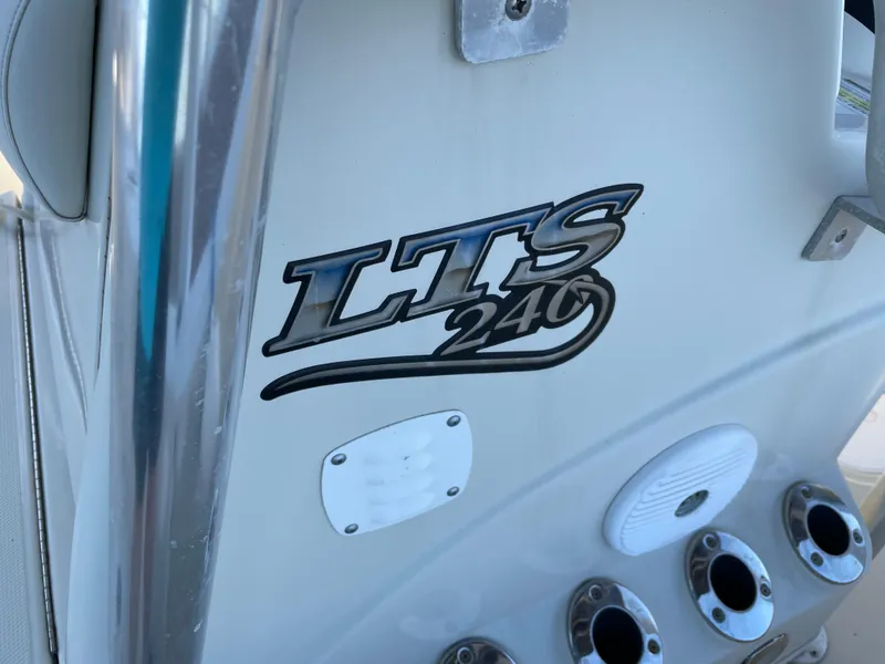 Slide: The Image of 2014 Triton 240 LTS Pro boat console with logo and fittings. - 15