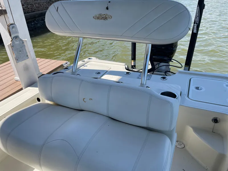 Slide: The Image of 2014 Triton 240 LTS Pro boat interior with cushioned seating. - 16