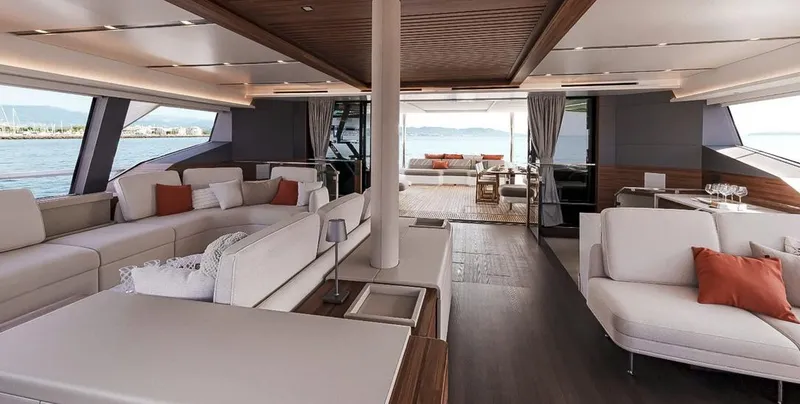 Slide: The Image of Luxurious interior of 2027 Fountaine Pajot Power 80 yacht with elegant seating and ocean view. - 13