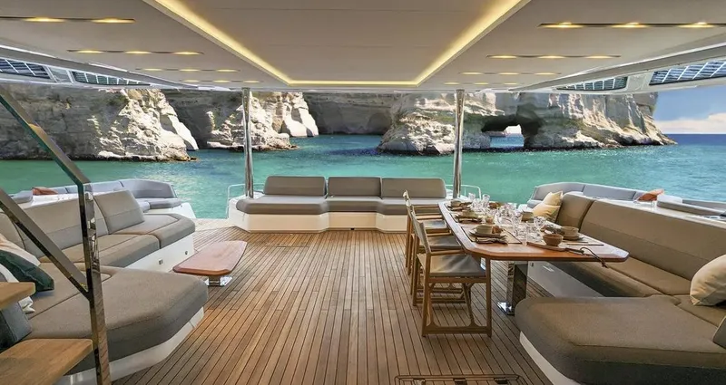 Slide: The Image of Luxurious 2027 Fountaine Pajot Power 80 yacht interior with elegant seating and dining area. - 8