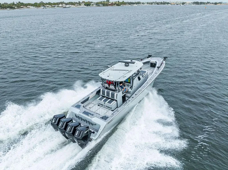 Slide: The Image of 2020 Front Runner 39 CC boat cruising on open water with powerful engines. - 1