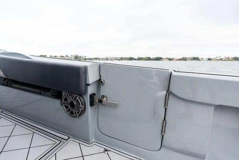 Slide: The Image of 2020 Front Runner 39 CC boat interior with speaker and cushioned seating. - 12