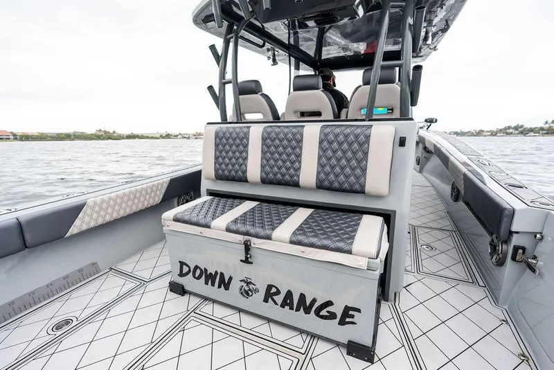 Slide: The Image of 2020 Front Runner 39 CC boat interior with custom seating and "Down Range" storage. - 13