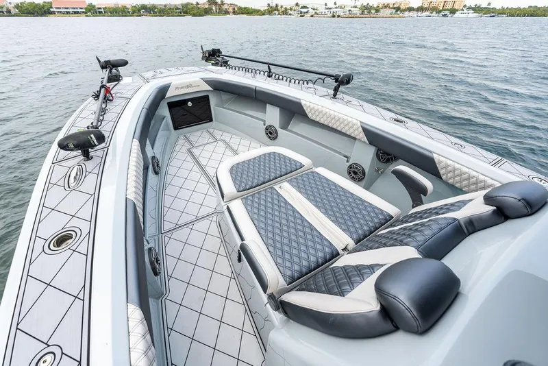 Slide: The Image of 2020 Front Runner 39 CC boat interior with cushioned seating and sleek design on the water. - 19