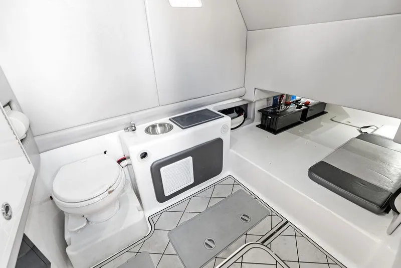 Slide: The Image of Interior of 2020 Front Runner 39 CC boat, featuring a compact bathroom and seating area. - 29