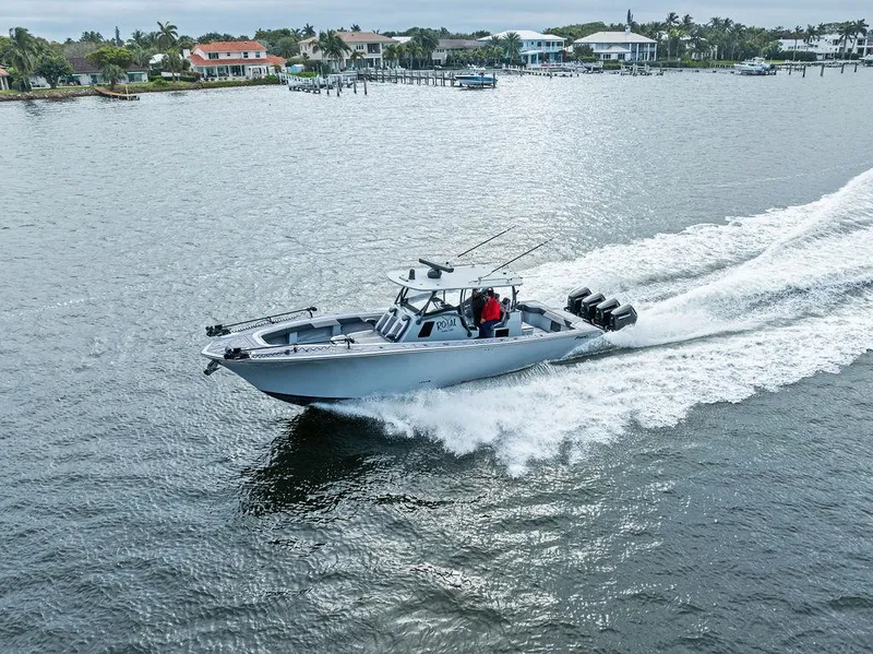 Slide: The Image of Front Runner 39 CC 2020 boat cruising on a scenic waterway. - 3