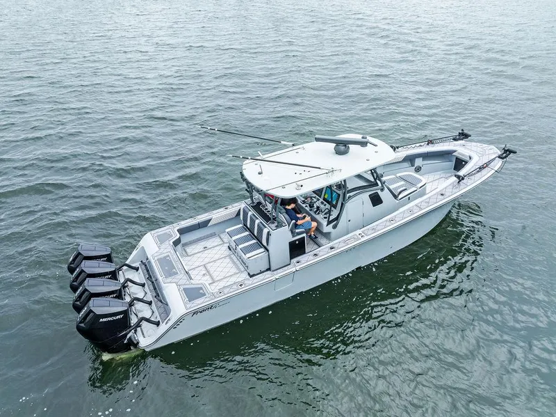 Slide: The Image of 2020 Front Runner 39 CC boat on water with multiple outboard engines. - 5