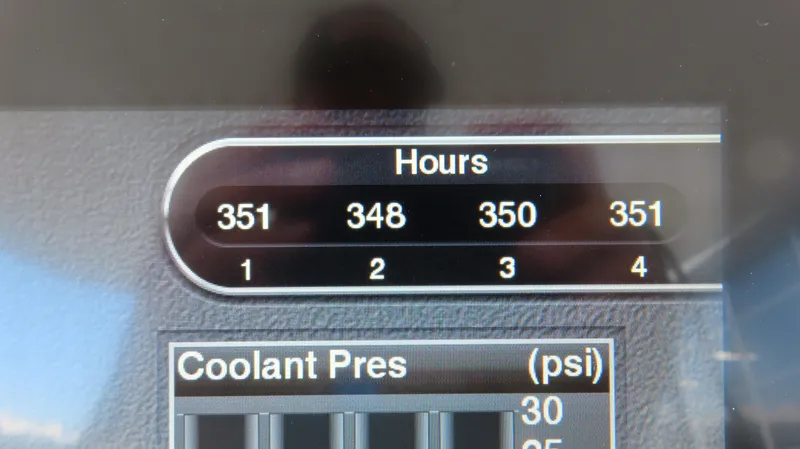 Slide: The Image of Dashboard display of a 2016 Cigarette 39 GTS showing engine hours and coolant pressure. - 10