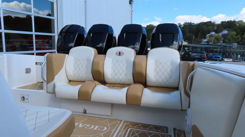 Slide: The Image of Luxurious seating on 2016 Cigarette 39 GTS boat with powerful engines in the background. - 11