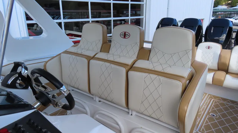 Slide: The Image of 2016 Cigarette 39 GTS boat interior with luxurious seating and steering wheel. - 12