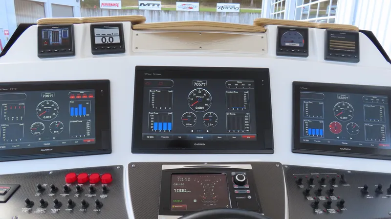 Slide: The Image of Dashboard of 2016 Cigarette 39 GTS boat with advanced navigation displays and controls. - 13