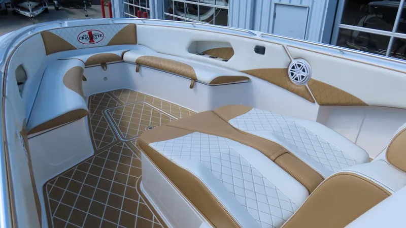 Slide: The Image of Luxurious interior of a 2016 Cigarette 39 GTS boat with tan and white seating. - 14