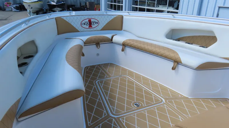 Slide: The Image of 2016 Cigarette 39 GTS boat interior with tan and white seating. - 15