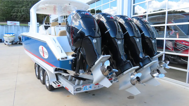 Slide: The Image of 2016 Cigarette 39 GTS boat with four powerful outboard engines on a trailer. - 5
