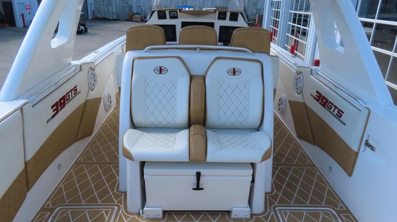 Slide: The Image of 2016 Cigarette 39 GTS boat interior with white and tan seating. - 6